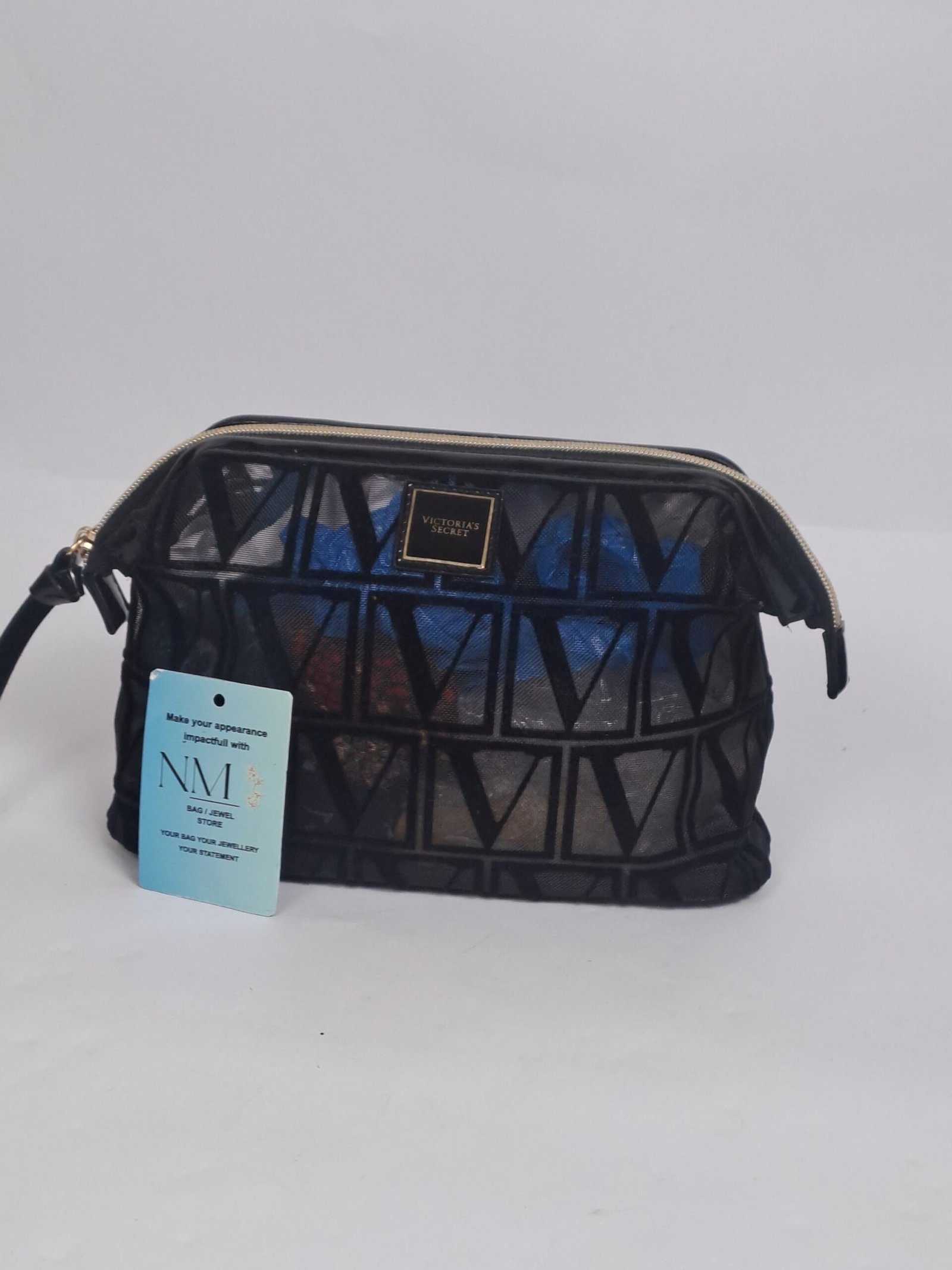 Preloved Authentic-styled Victoria's Secret signature monogram travel pouch.